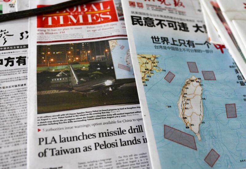 A map showing locations where Chinese People's Liberation Army (PLA) will conduct military exercises and training activities including live-fire drills is seen on newspaper reports of U.S. House of Representatives Speaker Nancy Pelosi's visit to Taiwan, at a newsstand in Beijing, China August 3, 2022. REUTERS/Tingshu Wang