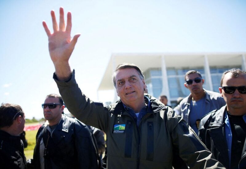 Brazilian President Jair Bolsonaro gestures after a ride on a motorbike in a motorcade rally with his supporters amid the coronavirus disease (COVID-19) pandemic, in Brasilia, Brazil, August 8, 2021. REUTERS/Adriano Machado