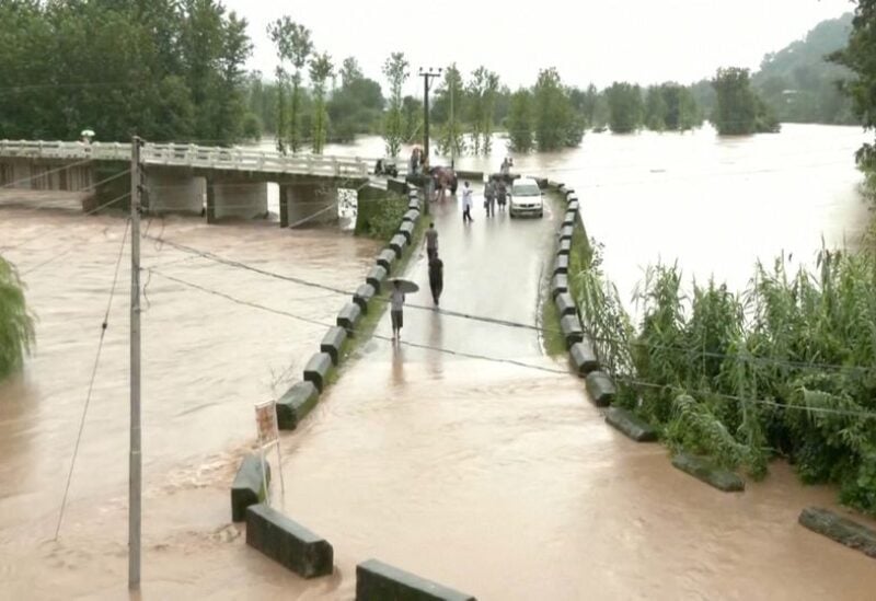 A general view of a flooded bridge following heavy rains in Mandi, Himachal Pradesh, India