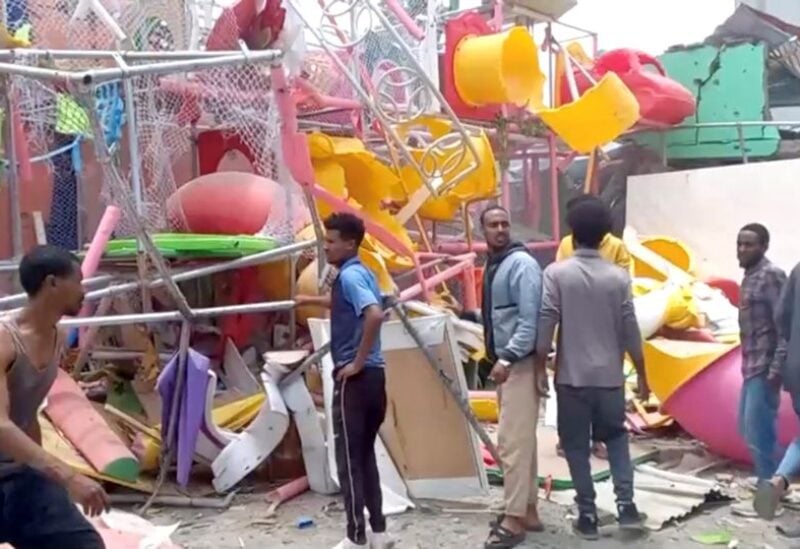 People inspect a damaged playground following an air strike in Mekelle, the capital of Ethiopia's northern Tigray region, August 26, 2022 in this still image taken from video. Tigrai TV/Reuters TV via REUTERS