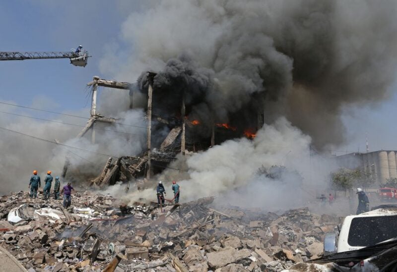 Firefighters extinguish a fire after blasts ripped through a fireworks warehouse in a shopping mall in Yerevan, Armenia August 14, 2022