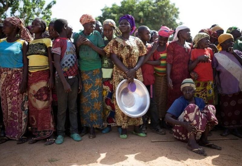 Women stand in line for food aid distribution delivered by the United Nations Office for the Coordination of Humanitarian Affairs and world food program in the village of Makunzi Wali, Central African Republic, April 27, 2017. REUTERS/Baz Ratner/File Photo
