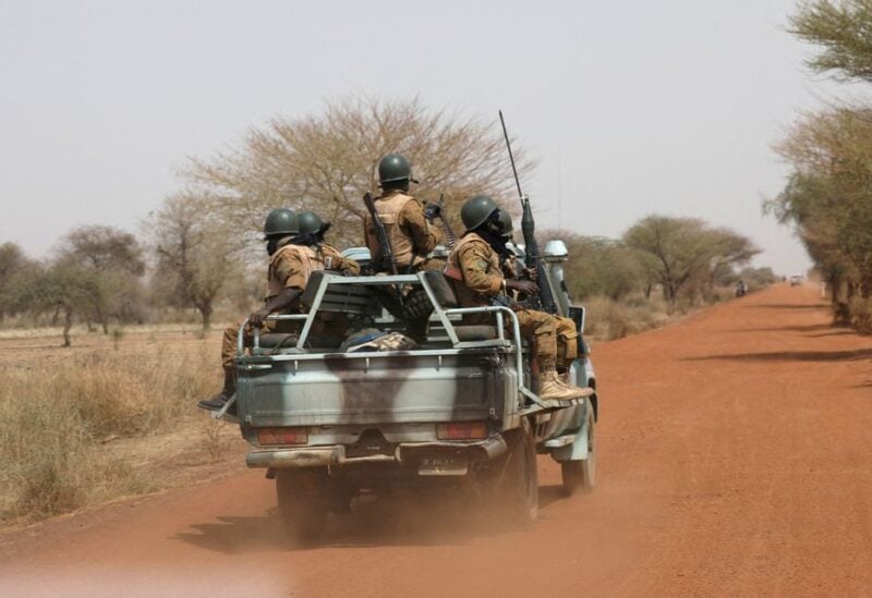 Soldiers from Burkina Faso patrol on the road of Gorgadji in the Sahel area, Burkina Faso March 3, 2019. Picture taken March 3, 2019. REUTERS/Luc Gnago/File Photo/File Photo