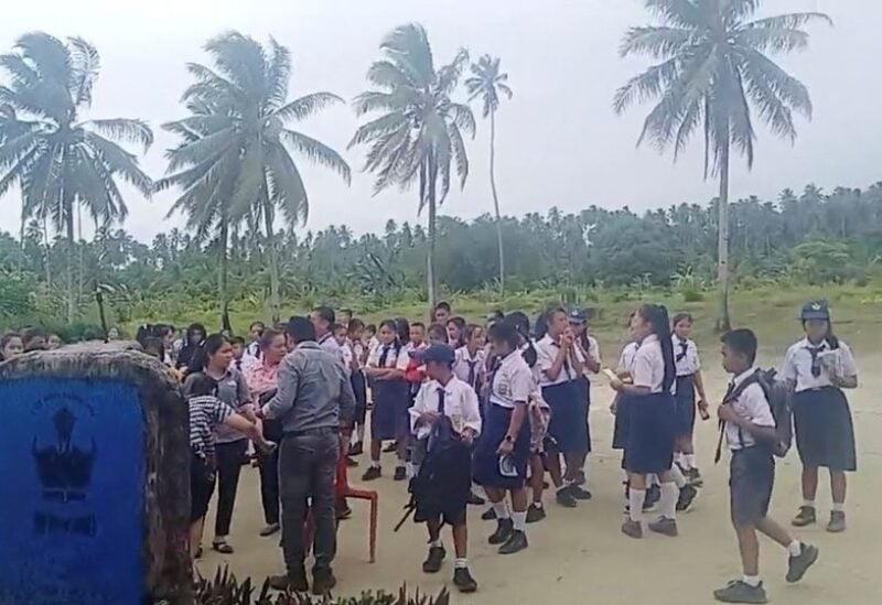 School students and staff gather in an open area after a magnitude 6.4 earthquake struck near Mentawai Islands, in South Nias, North Sumatra, Indonesia August 29, 2022 in this screen grab obtained from a social media video. Facebook/Doniman Aro Harefa/via REUTERS