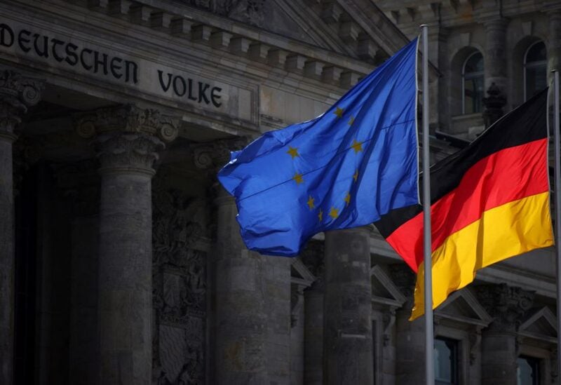 The flags of EU and Germany fly in front of Reichstag building, the seat of the lower house of the German parliament Bundestag, in Berlin, Germany, April 5, 2022. REUTERS/Lisi Niesner