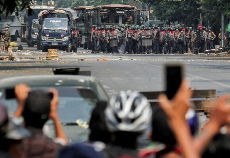 Police stand on a road during an anti-coup protest in Mandalay, Myanmar, March 3, 2021. REUTERS/Stringer/File Photo