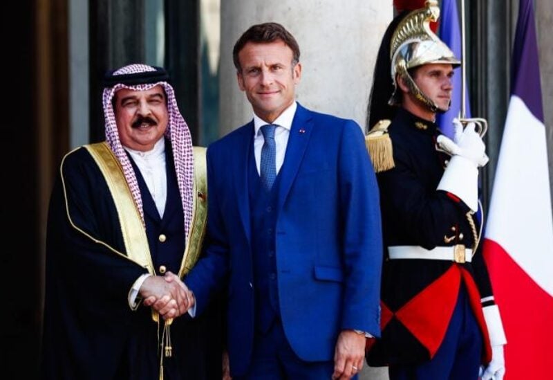 French President Emmanuel Macron (C) welcomes Bahrain's King Hamad bin Isa Al-Khalifa (L) to the Elysée Palace in Paris, France, 29 August 2022. (EPA)