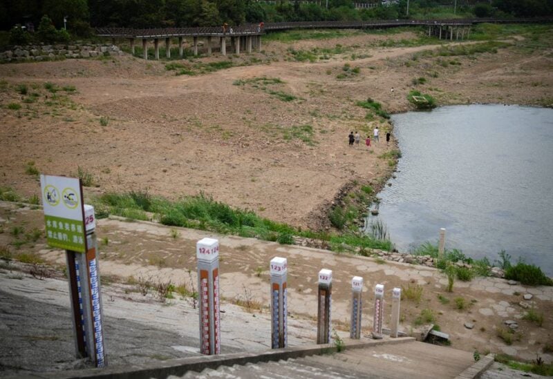 Water level poles emerge after waters receded in a reservoir, amid hot temperatures in Changxing, Zhejiang province, China
