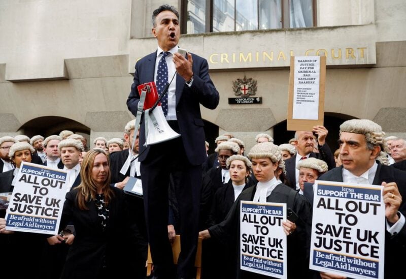 Jo Sidhu, Chair of the Criminal Bar Association, speaks during a strike by criminal barristers outside the 'Old Bailey' in London, Britain, June 27, 2022