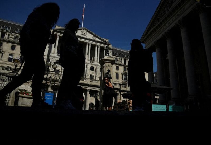 Pedestrians walk past the Bank of England, in London, Britain, August 8, 2022. REUTERS