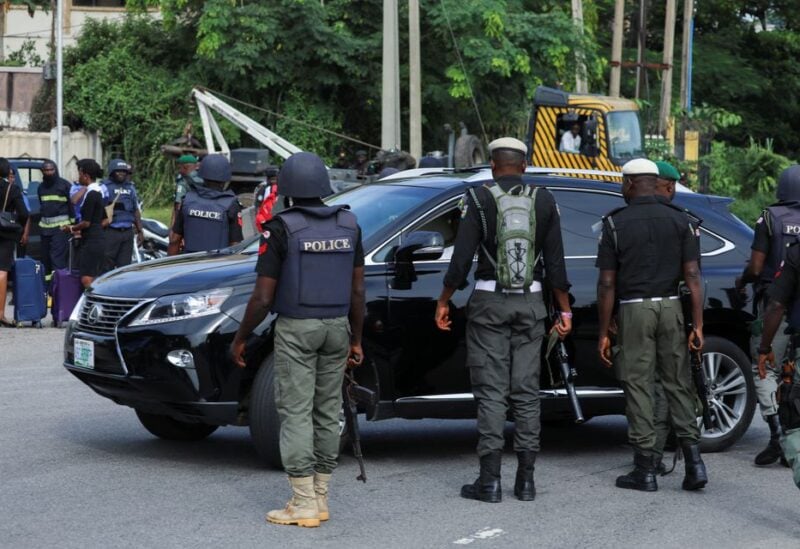 Police officers are seen conducting checks on vehicles at the Federal High court in Abuja, Nigeria October 21, 2021