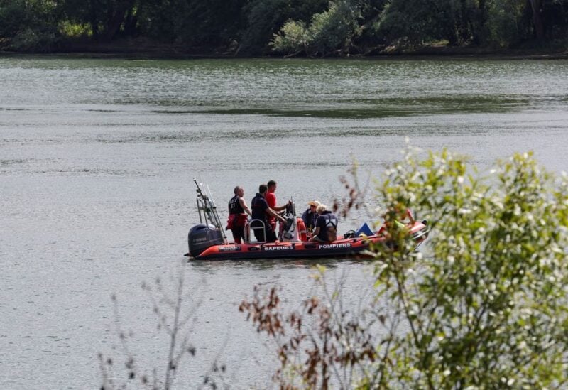 Rescue divers from the firefighter department patrol on Seine river in search for lost Beluga whale, in Les Andelys, France, August 5, 2022