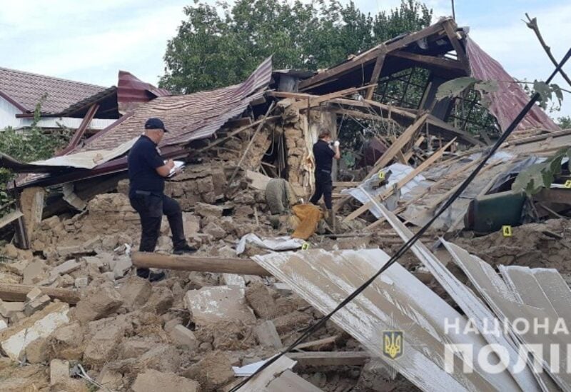 Police officers inspect a residential house destroyed by a Russian military strike, as Russia's attack on Ukraine continues, in the location given as Marhanets town, in Dnipropetrovsk region, Ukraine August 10, 2022. Press service of the National Police of Ukraine/Handout via REUTERS ATTENTION EDITORS - THIS IMAGE HAS BEEN SUPPLIED BY A THIRD PARTY. MANDATORY CREDIT. DO NOT OBSCURE LOGO.