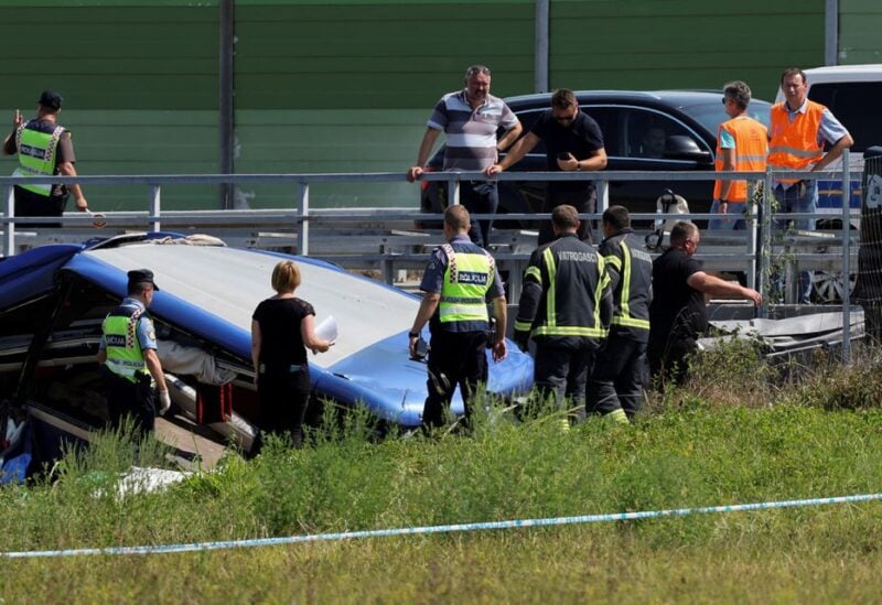 Rescuers work at the scene where a bus with Polish licence plates slipped off a road near Varazdin, northwestern Croatia, August 6, 2022