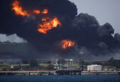 Fire is seen over fuel storage tanks that exploded near Cuba's supertanker port in Matanzas, Cuba, August 6, 2022