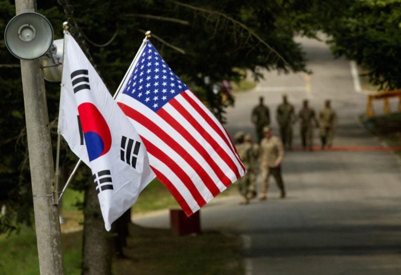 The South Korean and American flags fly next to each other at Yongin, South Korea, August 23, 2016. Picture taken on August 23, 2016. Courtesy Ken Scar/U.S. Army/Handout via REUTERS/File Photo