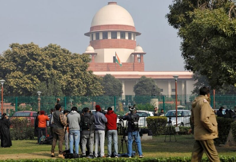 Television journalists are seen outside the premises of the Supreme Court in New Delhi, India, January 22, 2020. REUTERS