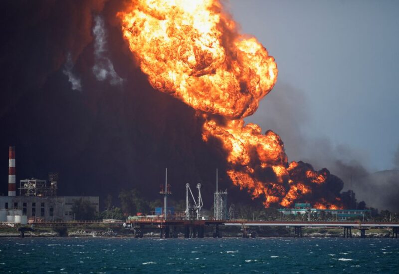 Fire is seen over fuel storage tanks that exploded near Cuba's supertanker port in Matanzas, Cuba, August 8, 2022
