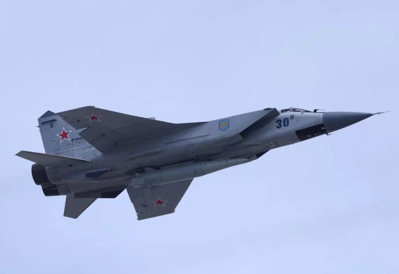 A Russian MiG-31 fighter jet equipped with a Kinzhal hypersonic missile flies over Red Square