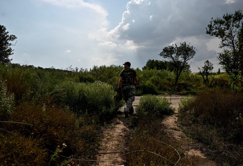A Ukrainian service member patrols an area near a frontline, amid Russia's attack on Ukraine continues, in Zaporizhzhia Region, Ukraine August 18, 2022. REUTERS/Dmytro Smolienko