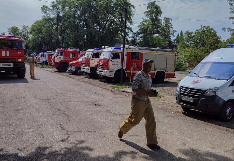 Firefighting and ambulance vehicles are parked in Azovskoye (Azovske) settlement following an explosion at a Russian military warehouse in the Dzhankoi district, Crimea, August 16, 2022. REUTERS/Stringer
