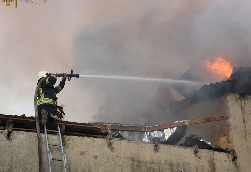 A firefighter works to douse a fire in a building, as Russia's attack on Ukraine continues, in Mykolaiv, in this handout picture released on July 31, 2022. State Emergency Service of Ukraine in Mykolaiv Region/Handout via REUTERS ATTENTION EDITORS - THIS IMAGE HAS BEEN SUPPLIED BY A THIRD PARTY. NO RESALES. NO ARCHIVES