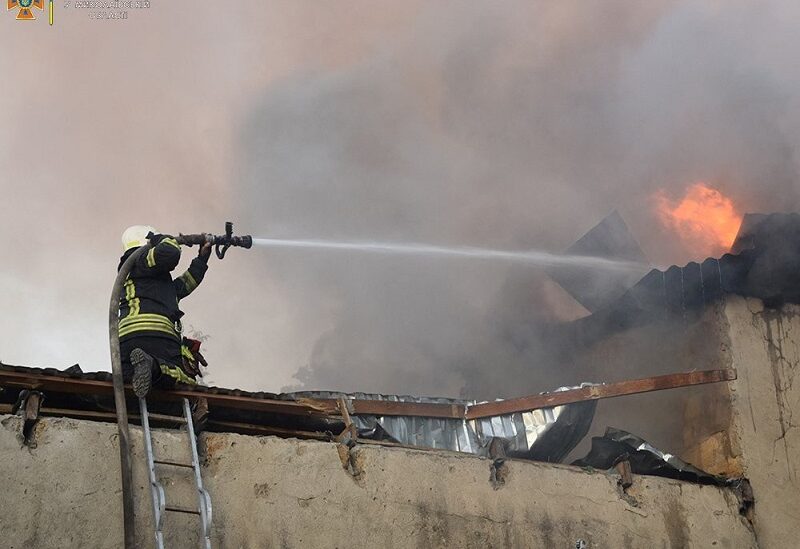 A firefighter works to douse a fire in a building, as Russia's attack on Ukraine continues, in Mykolaiv, in this handout picture released on July 31, 2022. State Emergency Service of Ukraine in Mykolaiv Region/Handout via REUTERS ATTENTION EDITORS - THIS IMAGE HAS BEEN SUPPLIED BY A THIRD PARTY. NO RESALES. NO ARCHIVES