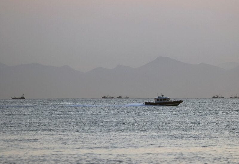 FILE PHOTO: A Taiwan Coast Guard ship travels past the coast of China, in the waters off Nangan island of Matsu archipelago in Taiwan August 16, 2022. REUTERS/Ann Wang/File Photo