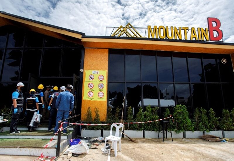 Forensic officers enter the Mountain B nightclub where at least 13 people were killed and 35 injured when a fire broke out early on Friday, in Chonburi province, Thailand, August 5, 2022. REUTERS/Tanat Chayaphattharitthee NO RESALES. NO ARCHIVE.