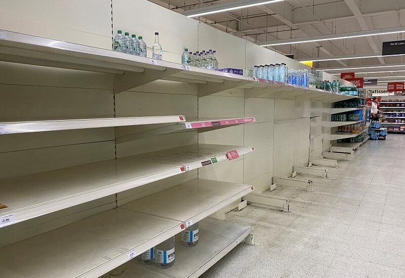 The bottled water section of an aisle at a Sainsbury's supermarket is seen almost empty, as restrictions over water usage continue in parts of the country, in London, Britain, August 18, 2022. REUTERS/Toby Melville