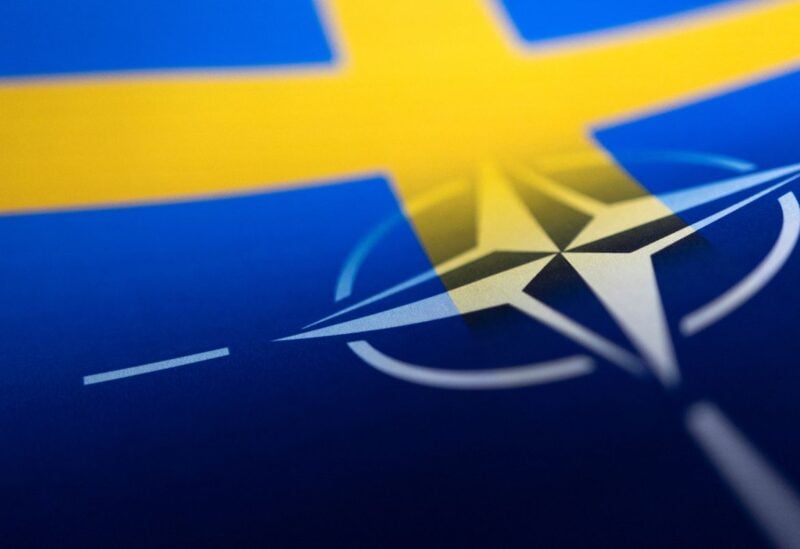 Swedish and NATO flags are seen printed on paper this illustration taken April 13, 2022. REUTERS/Dado Ruvic/Illustration