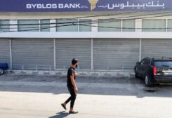 A man walks outside a closed Byblos Bank branch, where a man, according to security source, was detained after holding up the bank to access his own savings, in the southern city of Ghazieh, Lebanon September 16, 2022. REUTERS/Aziz Taher