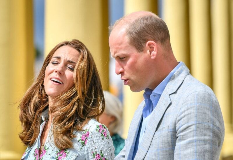 Britain's Prince William and Catherine, Duchess of Cambridge walk on the promenade as they visit beach huts during their visit to Barry Island, South Wales, amid the coronavirus disease (COVID-19) outbreak, Britain August 5, 2020. Ben Birchall/Pool via REUTERS