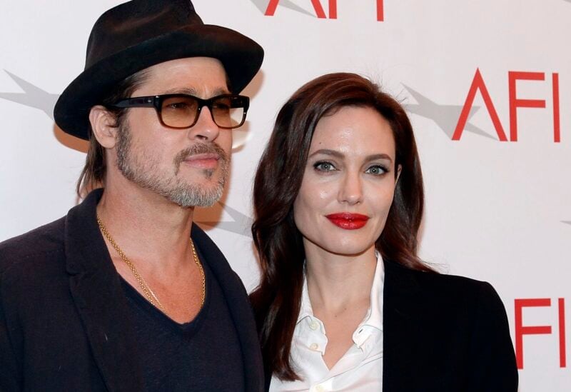 Actor Brad Pitt and actress/director Angelina Jolie pose at the AFI Awards 2014 honoring excellence in film and television in Beverly Hills, California on January 9, 2015. REUTERS/Kevork Djansezian