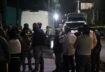 People stand outside a bar where unidentified gunmen opened fire killing several people, officials said, in the latest outbreak of violence, in Tarimoro, Guanajuato state, Mexico September 21, 2022. REUTERS/Juan Moreno