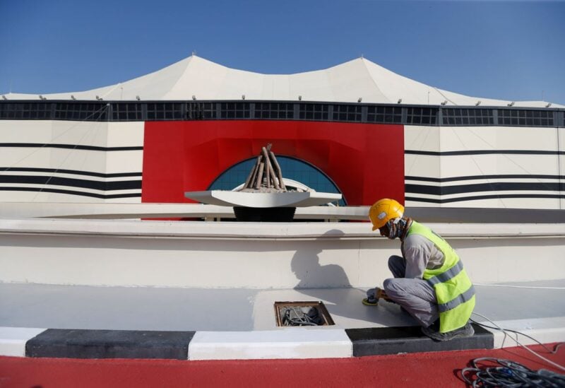 A worker puts final touches at Al Bayt Stadium, one of the venues of the Qatar World Cup 2022, in Al Khor, Qatar, November 17, 2021. REUTERS/Hamad I Mohammed/File Photo