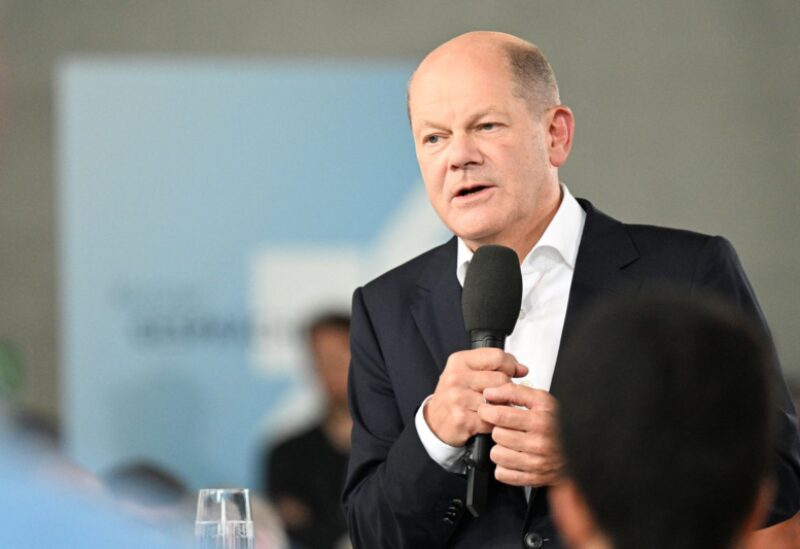 German Chancellor Olaf Scholz talks with citizens during a town hall event in Essen, Germany, September 1, 2022. REUTERS/Benjamin Westhoff