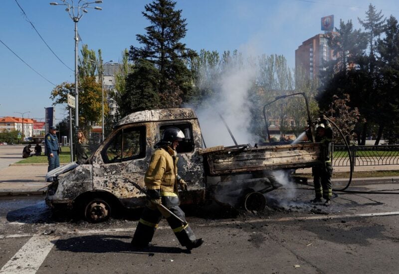Firefighters extinguish a vehicle that caught fire during recent shelling in the course of Russia-Ukraine conflict in Donetsk, Ukraine September 17, 2022. REUTERS/Alexander Ermochenko
