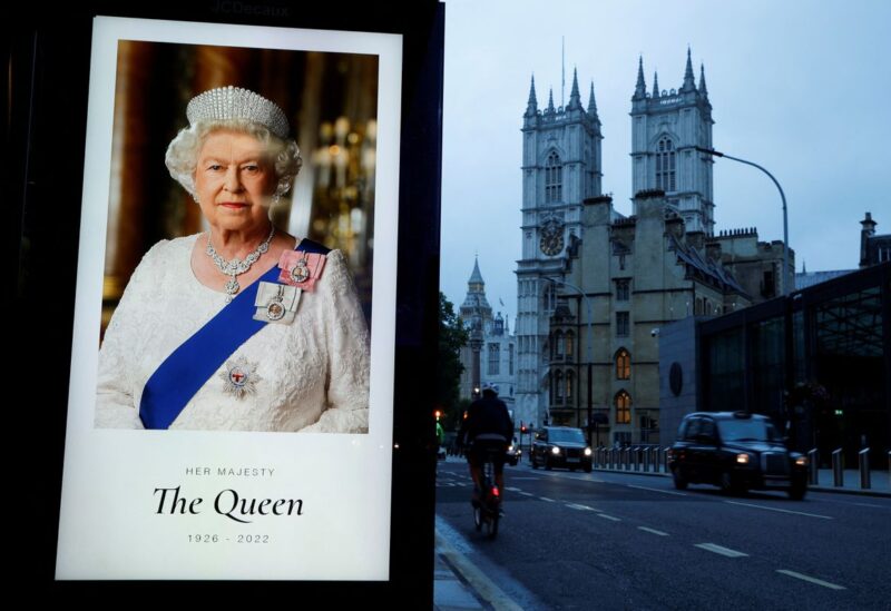 A portrait of Queen Elizabeth is displayed at a bus stop outside Westminster Abbey, following the passing of Queen Elizabeth, in London, Britain, September 9, 2022. REUTERS/John Sibley