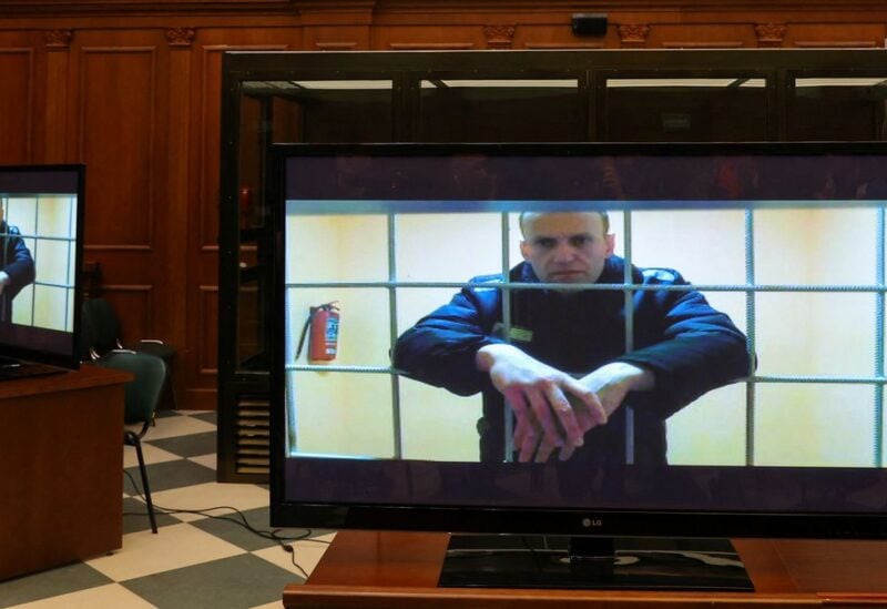 Russian opposition leader Alexei Navalny is seen on screens via a video link from the IK-2 corrective penal colony in Pokrov during a court hearing to consider an appeal against his prison sentence in Moscow, Russia May 24, 2022. REUTERS/Evgenia Novozhenina