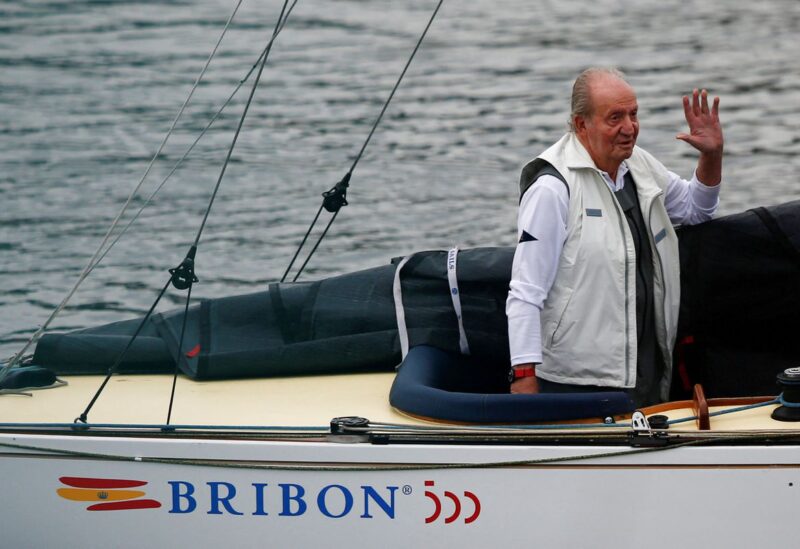 Former Spanish King Juan Carlos waves at people in his boat during a sailing regatta at Sanxenxo Sailing Club in Sanxenxo, Spain, May 21, 2022. REUTERS/Pedro Nunes/File Photo