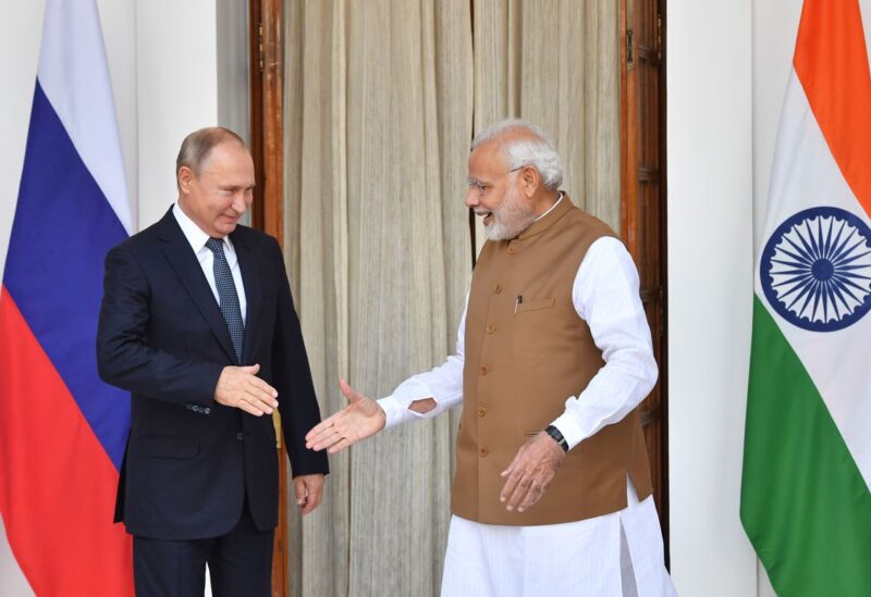 Indian Prime Minister Narendra Modi welcomes Russian President Vladimir Putin prior to their meeting at Hyderabad House in New Delhi, India October 5, 2018. Yuri Kadobnov/Pool via REUTERS