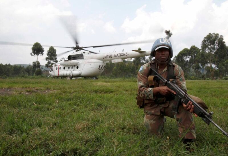 A United Nations peacekeeper stands guard as a helicopter in eastern Democratic Republic of Congo, October 3, 2010. REUTERS/Katrina Manson