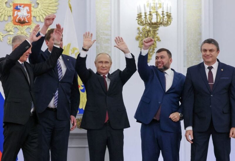 Russian President Vladimir Putin and Denis Pushilin, Leonid Pasechnik, Vladimir Saldo, Yevgeny Balitsky, who are the Russian-installed leaders in Ukraine's Donetsk, Luhansk, Kherson and Zaporizhzhia regions, attend a ceremony to declare the annexation of the Russian-controlled territories of four Ukraine's Donetsk, Luhansk, Kherson and Zaporizhzhia regions, after holding what Russian authorities called referendums in the occupied areas of Ukraine that were condemned by Kyiv and governments worldwide, in the Georgievsky Hall of the Great Kremlin Palace in Moscow, Russia, September 30, 2022. Sputnik/Mikhail Metzel/Pool via REUTERS
