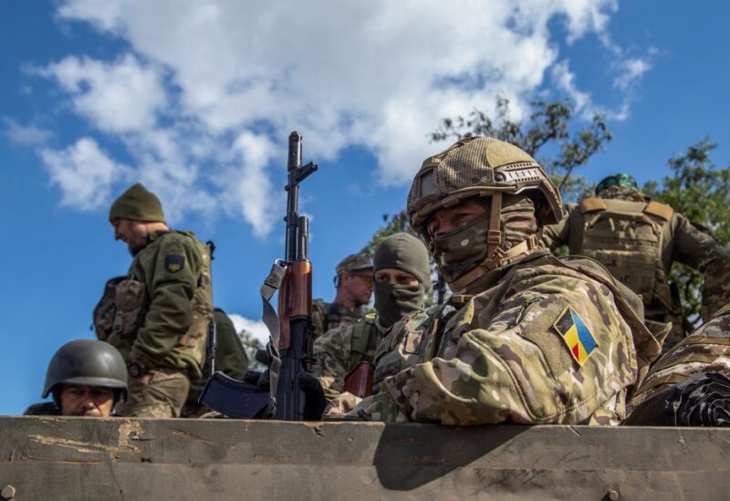 Ukrainian service members ride in a military vehicle, amid Russia's attack on Ukraine, in Kharkiv region, Ukraine September 24, 2022. REUTERS