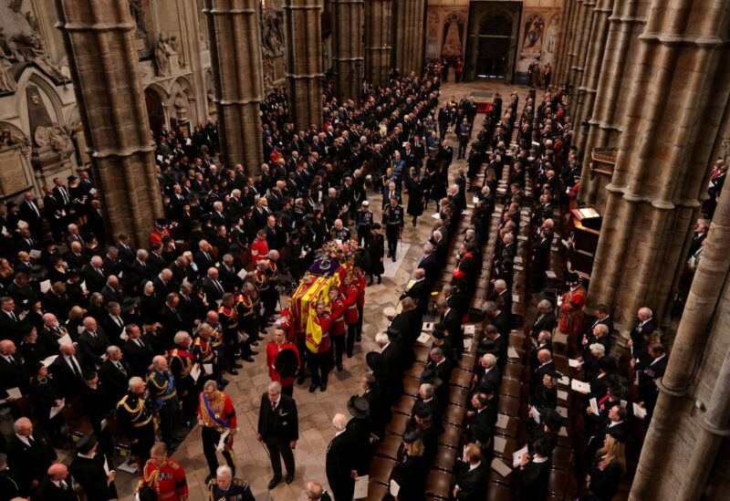 King Charles III, the Queen Consort, the Princess Royal, Vice Admiral Sir Tim Laurence, the Duke of York, the Earl of Wessex, the Countess of Wessex, the Prince of Wales, the Princess of Wales, Prince George, Princess Charlotte, the Duke of Sussex, the Duchess of Sussex, Peter Phillips and the Earl of Snowdon follow behind the coffin of Queen Elizabeth II, in Westminster Abbey, London, Britain September 19, 2022. Jack Hill/Pool via REUTERS