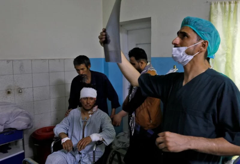 A medic checks an X-ray film of a man who was wounded after a suicide bomber detonated explosives near the entrance of the Russian embassy, inside a hospital in Kabul, Afghanistan, September 5, 2022. REUTERS