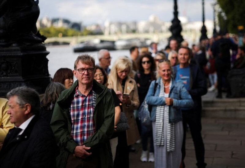 People stand in a queue to pay respect to Britain's Queen Elizabeth, following her death, in London, Britain September 15, 2022. REUTERS/Carlos Barria
