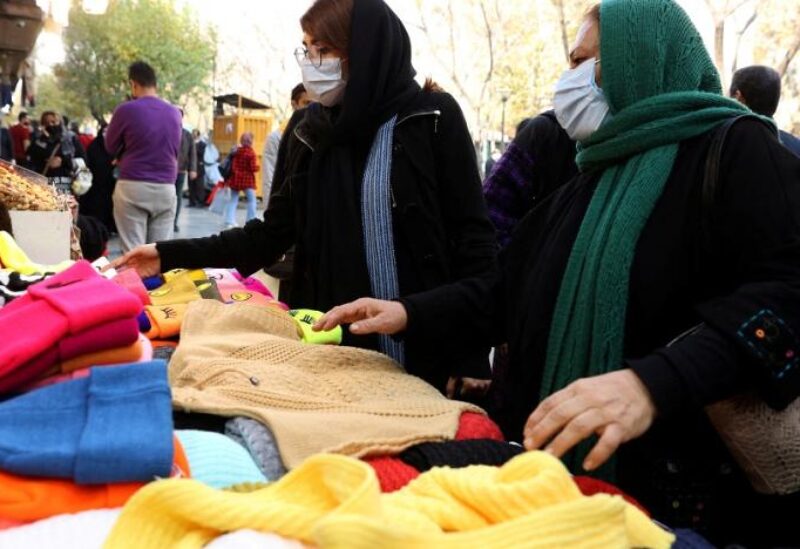 Women shop at a street in Tehran, Iran, November 29, 2021.