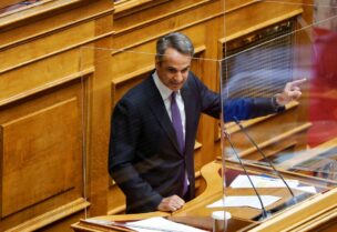 Greek Prime Minister Kyriakos Mitsotakis addresses lawmakers during a parliamentary session on a wiretapping case, in Athens, Greece, August 26, 2022. REUTERS/Costas Baltas